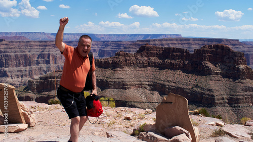Adventurous Spirit; Elderly Man Embracing a Unique Moment at the Grand Canyon.