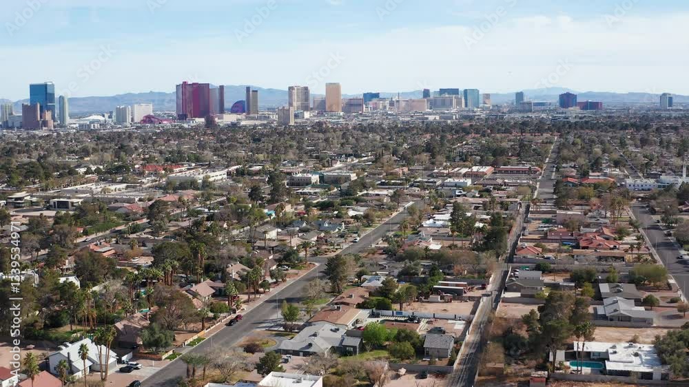 Aerial drone view of Las Vegas city skyline with residential homes and trees 03 Aerial drone view of Las Vegas city skyline with residential homes and trees 03