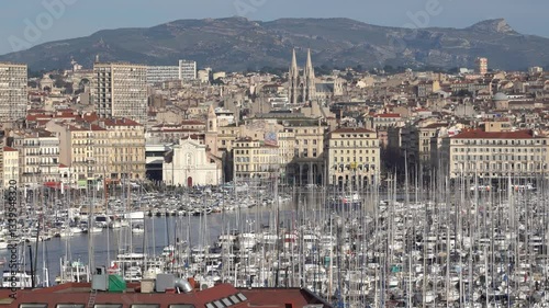 Marseille, France - February 2, 2025: Panoramic view of the city. View of the city real estate and the marina with yachts