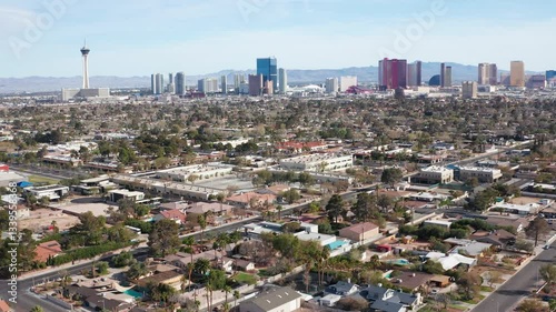 Aerial drone view of Las Vegas city skyline with residential homes and trees 05