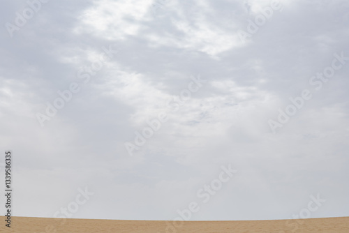Wallpaper Mural Expansive desert landscape under a cloudy sky inviting adventure Torontodigital.ca