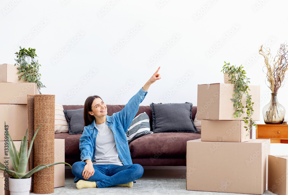 Happy young woman moving into new home