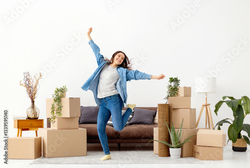 Obraz na płótnie Happy woman jumping among moving boxes at home w salonie