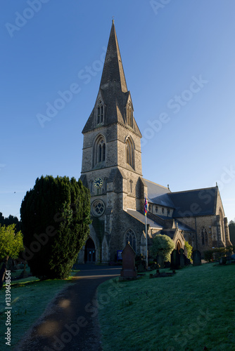Obraz na płótnie Swindon Christ Church entrance on a sunny morning in the winter. Footpath towards the entrance. Vertical view. w salonie