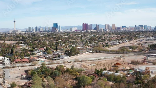 Aerial drone view of Las Vegas city skyline with residential homes and trees 08