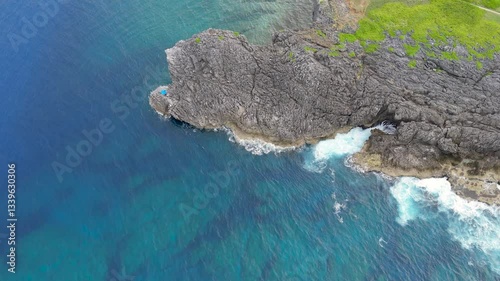 Aerial drone shots of waves hitting the reef, okinawa japan 