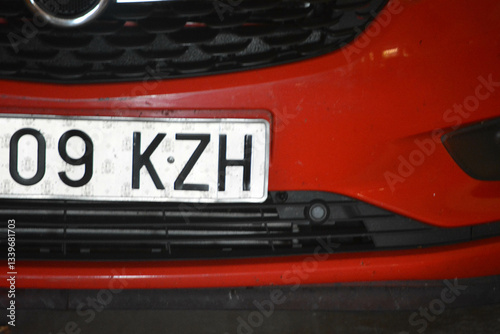 High-quality image of a Spanish license plate (matrícula española) on a vehicle, showcasing the European Union blue strip with the 'E' country code for Spain.  KZH