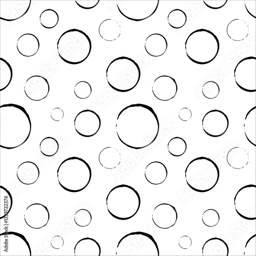 Black ink circles on white background, handcrafted seamless pattern for print, textile and fabric. Minimalistic design for wrapping, backdrops and wallpapers.