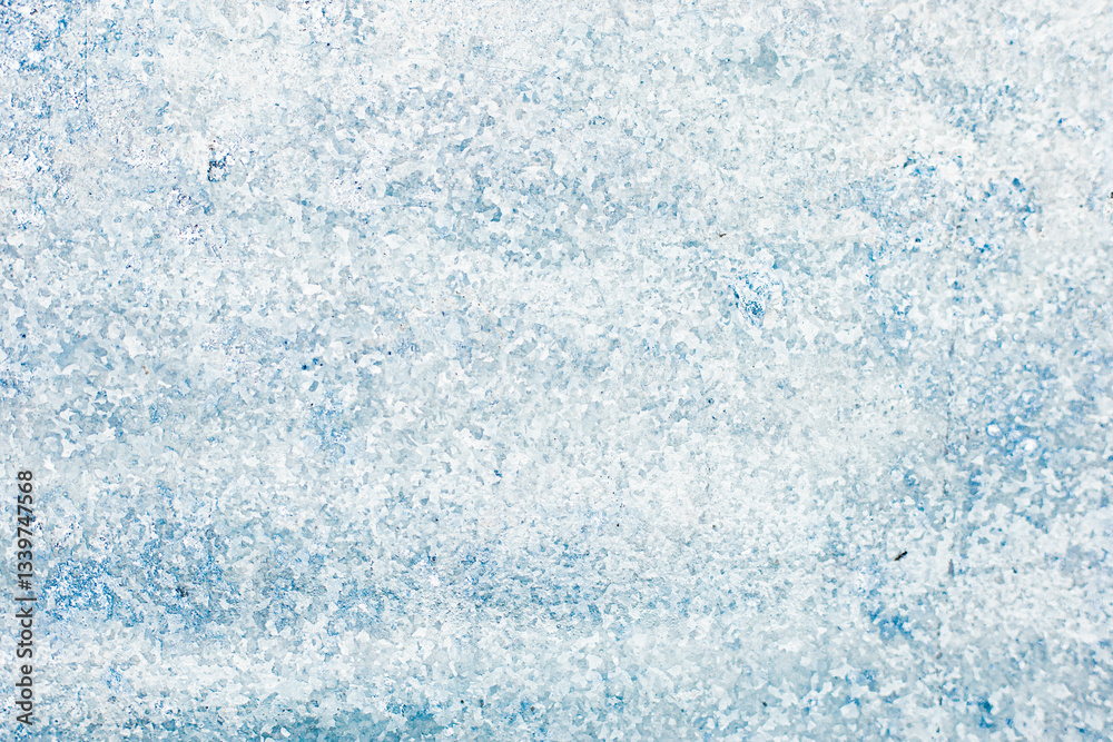 Obraz premium Close-up background of frosty textured surface with crystalline ice patterns for your text