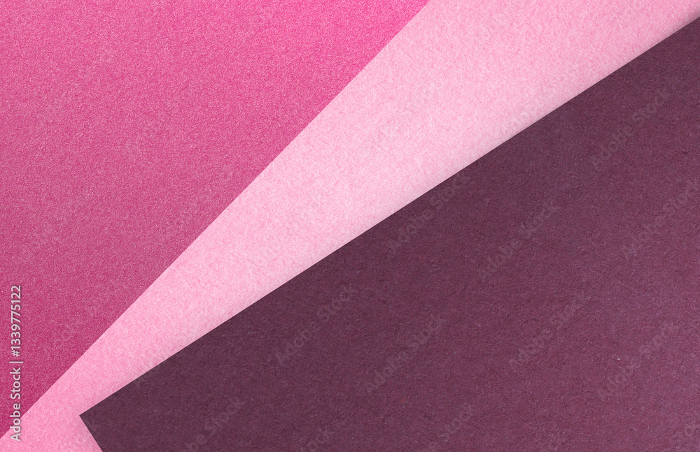 Fototapeta premium Modern pink and burgundy textured paper background with layered geometric composition. Perfect for creative projects.