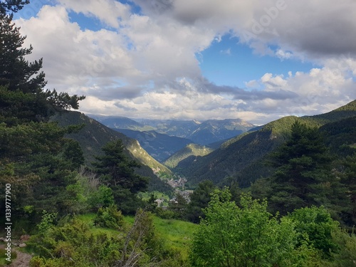 Landscape view of green mountains at summer with yellow flowers and house, Arinsal, pirineos, Andorra