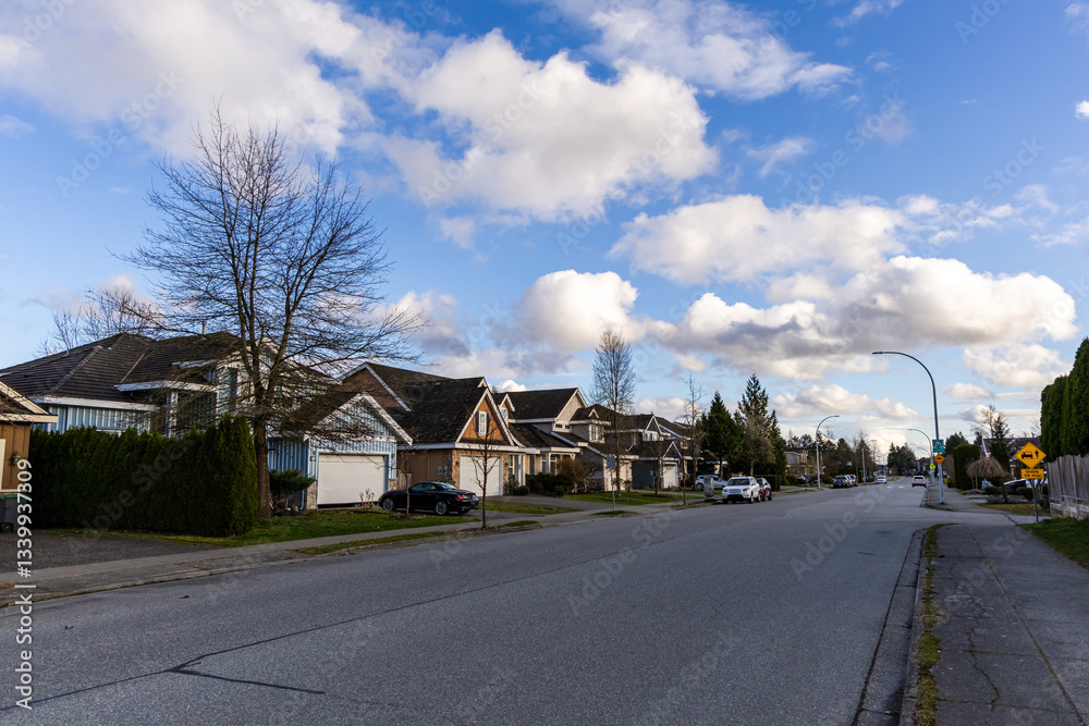 Obraz premium Residential Street in Fraser Heights Surrey, BC with Blue Sky and Clouds