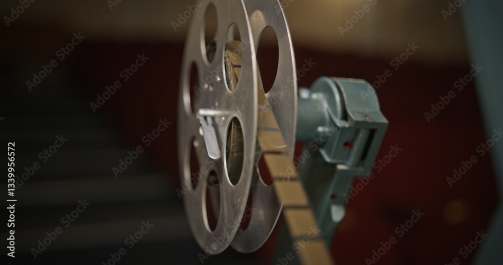 Obraz premium A CloseUp View of a Vintage Film Reel in a Cinema Setting with Nostalgic Cinematic Charm