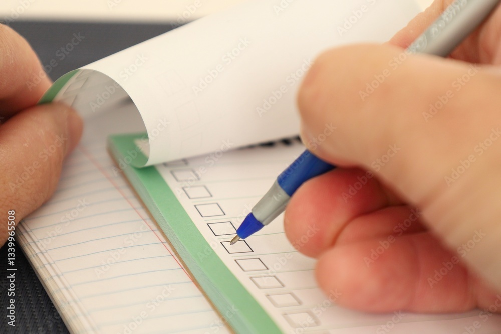 notebook and hand with pen notebook and hand with pen