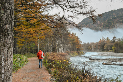 Landscape Views Of Taisho Pond Trail With Autumn Leaves And Morning Fog Along Azusagawa RiverAt Kamikochi, Chubu Sangaku National Park, Nagano, Japan  photo