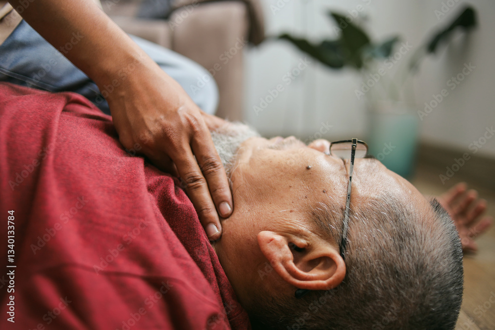 Close Up Of Finger Checking Pulse Of Unconscious Old Man At Home. First Aid Close Up Of Finger Checking Pulse Of Unconscious Old Man At Home. First Aid