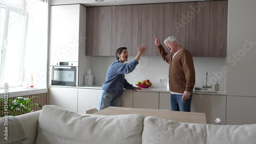 Furious agitated screaming mature couple arguing yelling, nearly fighting, accusing, humiliating each other. Broken trust, toxic conflict, emotional abuse, shattered marriage, divorce approaching
