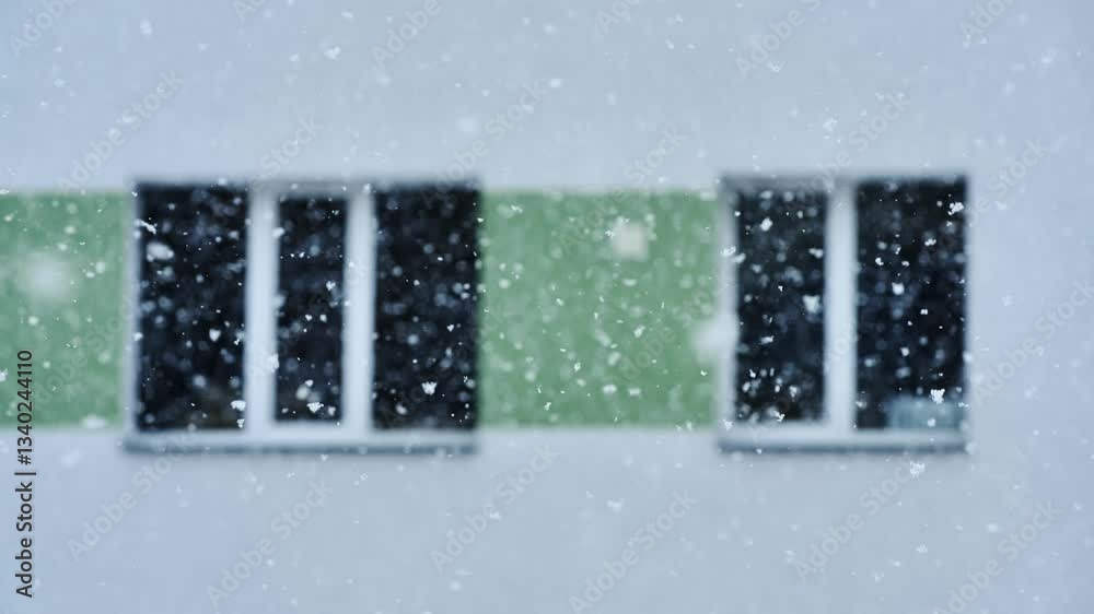 Snowflakes in motion with Khrushchyovka building featuring modern facade updates
