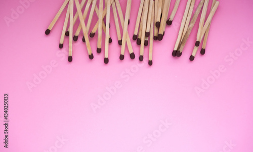 The matches lie in the upper part of the frame on a pink background. There is a space for the text.
