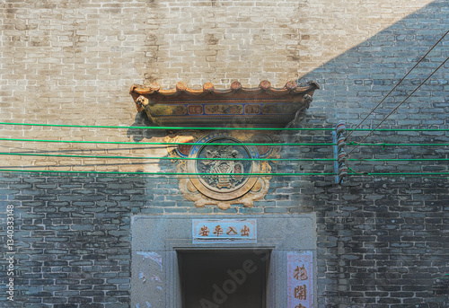 Foshan city, Guangdong, China. Nanhai Shishan Huangxi Village with a history of 800 years preserves various types of ancient buildings in the Lingnan style, traditional wood and brick carving. photo