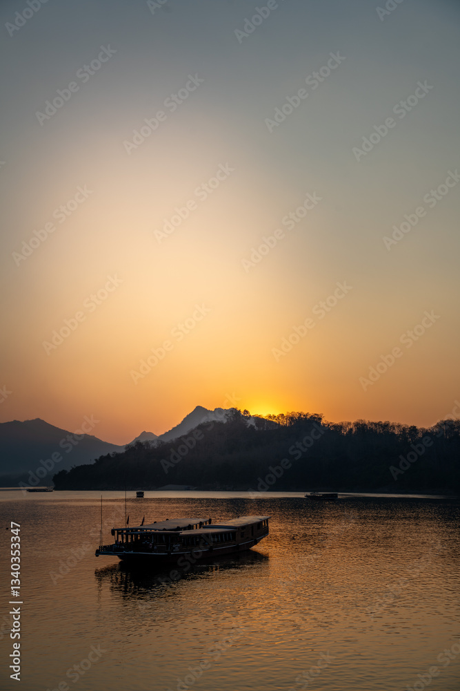 Naklejka premium Sunset over Mekong River, Laos. Peaceful evening, natural landscape