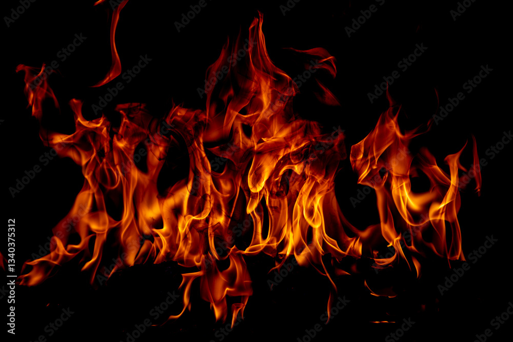 Texture of fire on a black background. Abstract fire flame background, large burning fire. Texture of fire on a black background. Abstract fire flame background, large burning fire.