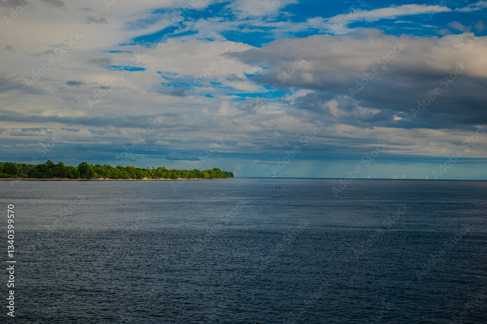Obraz premium View of the island from the ocean on a boat during a trip in Maluku, Indonesia