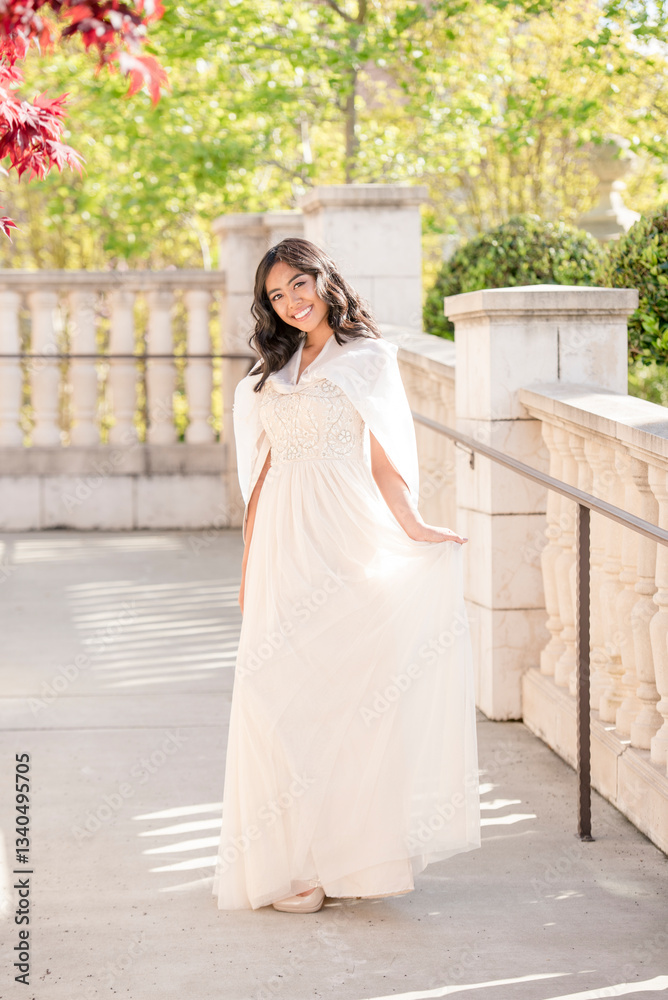 Fototapeta premium Radiant high school graduate shines in her elegant prom dress