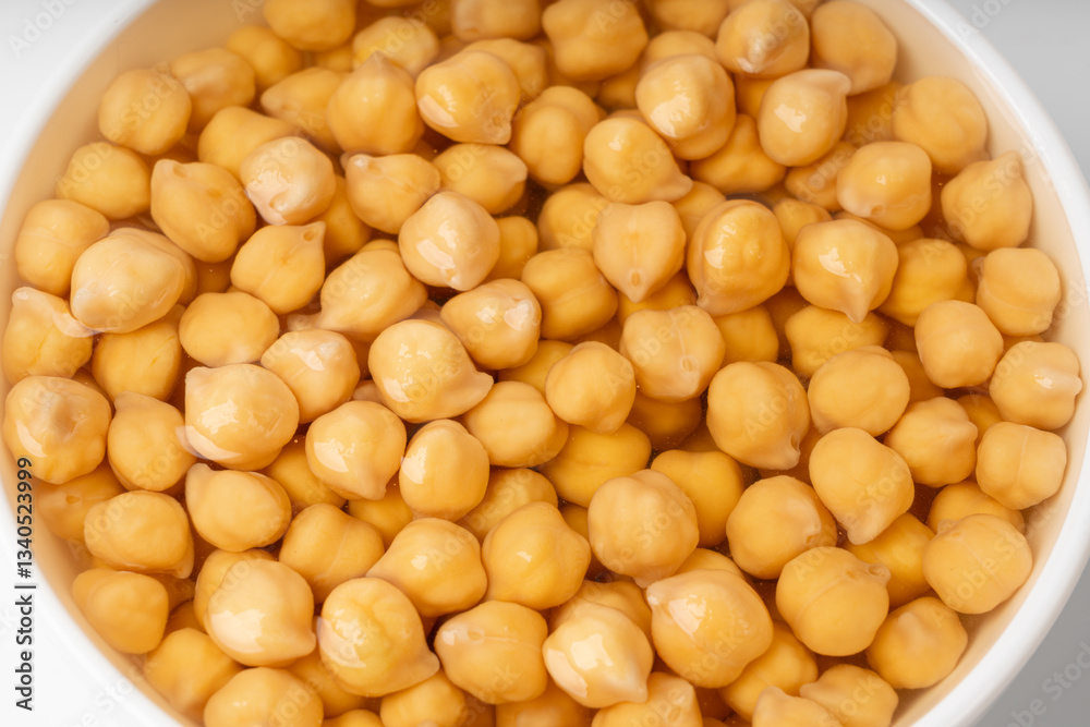 Soaked chickpeas, chick pea in water, swollen wet Cicer arietinum fruits, garbanzo beans cooking Soaked chickpeas, chick pea in water, swollen wet Cicer arietinum fruits, garbanzo beans cooking
