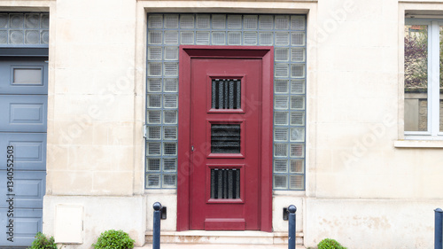 red French door wooden burgundy vintage traditional european entrance to a private house in city Center