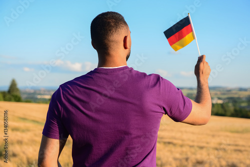 Young man with flag of Germ...