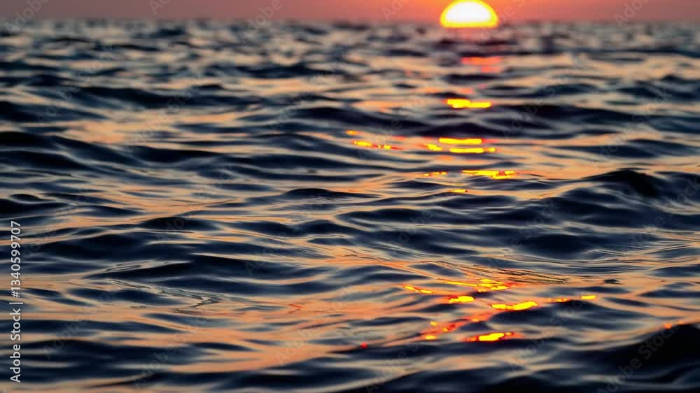 Warm golden light reflecting across tranquil ocean surface, illuminating rippling waves during peaceful evening twilight seascape Warm golden light reflecting across tranquil ocean surface, illuminating rippling waves during peaceful evening twilight seascape