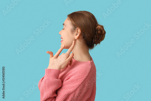 Beautiful young woman point...