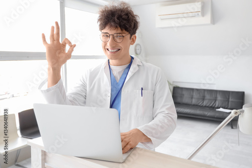 Male medical intern with la...