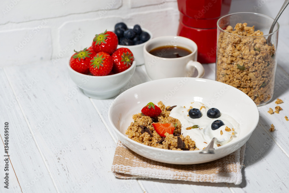 breakfast with crunchy granola, greek yogurt and fresh berries breakfast with crunchy granola, greek yogurt and fresh berries