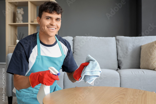 Young man cleaning coffee t...