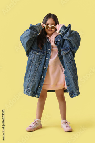 Cute little Asian girl in a...