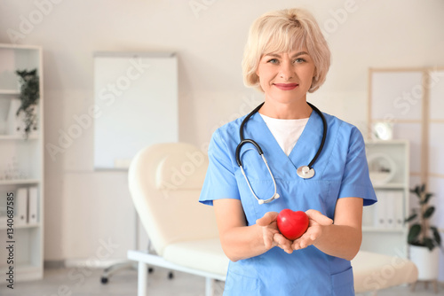 Female doctor with heart at hospital