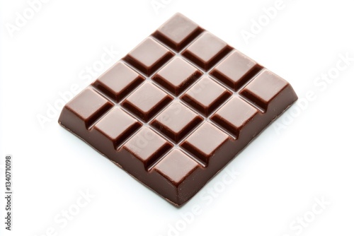 A piece of chocolate sits on a white surface, perfect for displaying or using as a prop