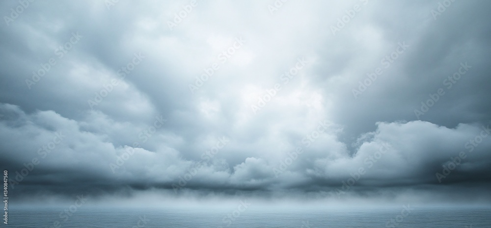 Obraz premium Moody Seascape with Dramatic Clouds and Approaching Storm