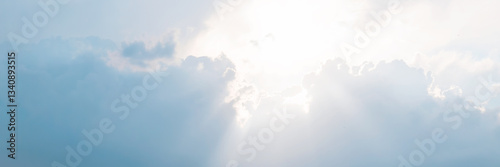 Obraz na płótnie Beautiful sky background with clouds and sunbeams. Dramatic cloudscape with sun rays. Bright sunshine and sunny glow. Wide panoramic background for design. w salonie