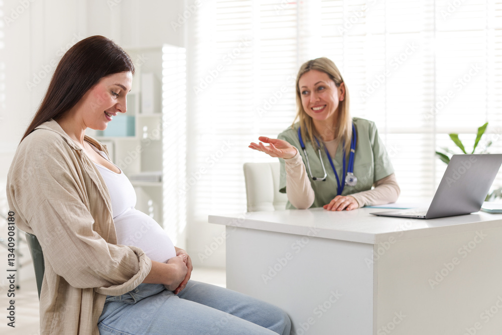 Pregnant woman having appointment with doctor in clinic Pregnant woman having appointment with doctor in clinic