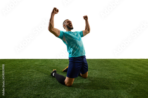 Passionate footballer celebrating victory, kneeling on grass, fists clenched, roaring in triumph, emotions pouring after decisive match. Concept of glory, dedication, competition, final goal, success. photo