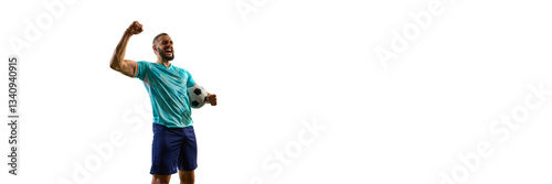 Banner. Overjoyed football champion gripping ball, raising fist in victorious gesture, expression radiating pure triumph, ultimate tournament moment. Concept of sport, success, leadership and teamwork