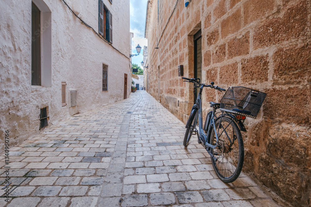 The charm of Ciutadella with this image of a historic alley, a classic bicycle, old architecture, Stone Streets, Relaxed Lifestyle. Ideal for travel, culture, and Mediterranean lifestyle themes.