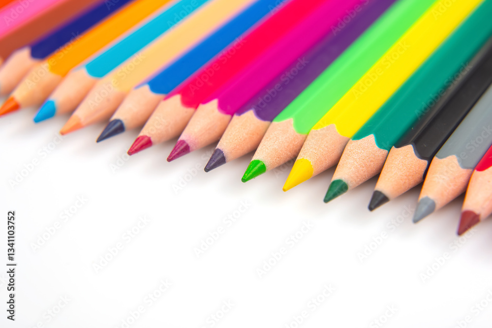 A vibrant collection of colored pencils in a straight line on a white background. Perfect for art education, stationery, or creative inspiration themes.