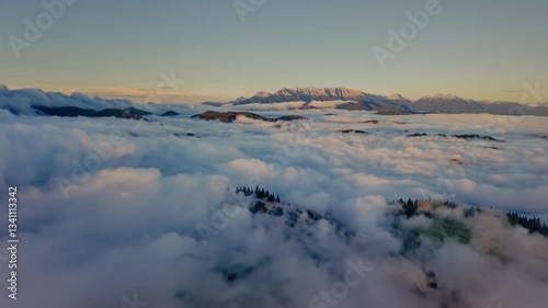 Misty Valley Dawn: Fog Lifting Over Rolling Mountains