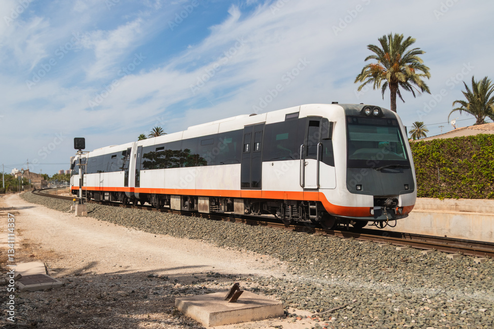 Fototapeta premium Modern tram train running on railway in suburban area