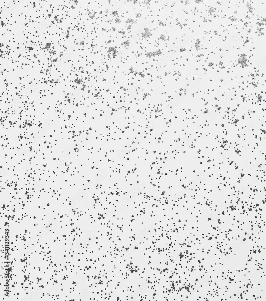 Dense silver glitter scattered across a pure white background, creating a sparkling texture, celebration, high resolution Dense silver glitter scattered across a pure white background, creating a sparkling texture, celebration, high resolution