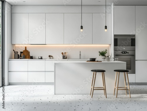 A modern kitchen is shown with white cabinets and island